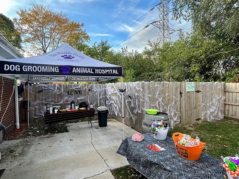 Dog grooming and animal hospital event tent decorated for Howl-o-Ween in Carol Stream