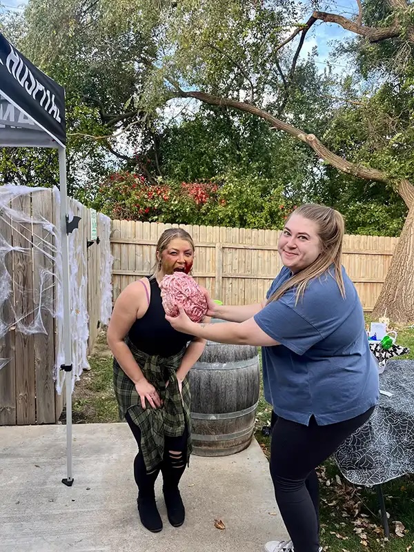 Veterinary staff in Halloween costumes having fun at a Howl-o-Ween community event in Carol Stream
