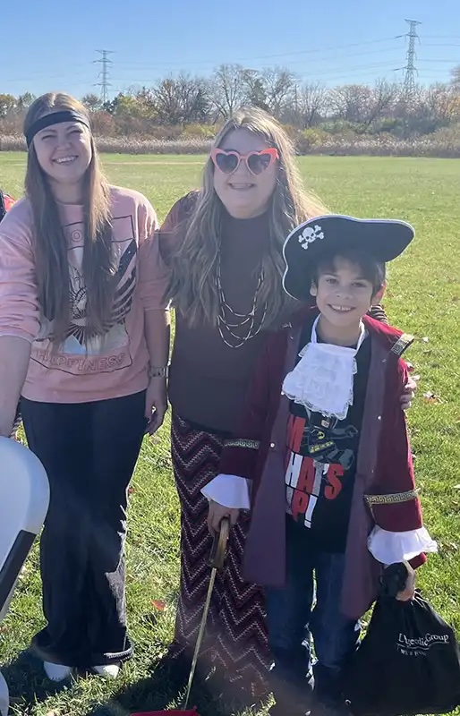 Veterinary staff in Halloween costumes at an outdoor community Howl-o-Ween event in Carol Stream